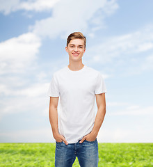 Image showing smiling young man in blank white t-shirt