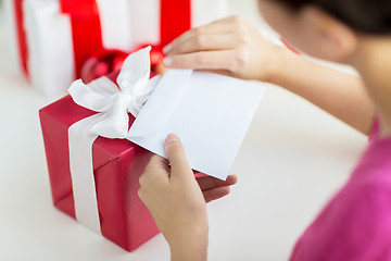 Image showing close up of woman with letter and presents