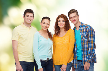 Image showing group of smiling teenagers over green background