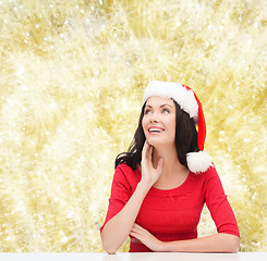 Image showing smiling woman in santa helper hat