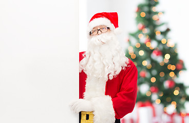 Image showing man in costume of santa claus with billboard