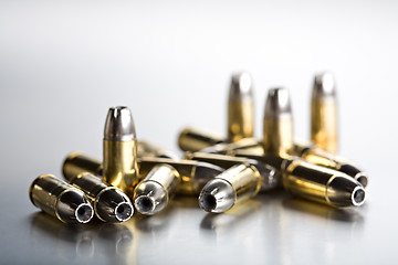 Image showing bullets closeup on cold brushed metal