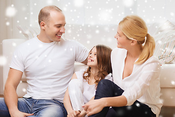 Image showing smiling parents and little girl at home