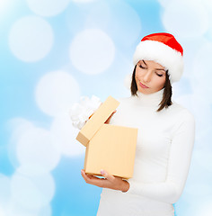 Image showing woman in santa helper hat with gift box