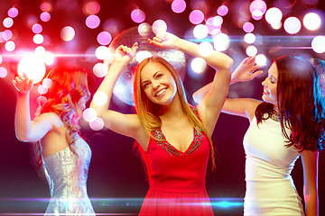 Image showing three smiling women dancing in the club