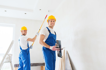 Image showing group of builders with tools indoors