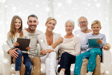 Image showing smiling family with tablet pc computers at home