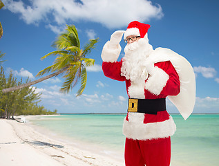 Image showing man in costume of santa claus with bag