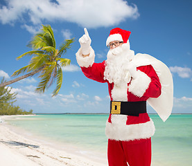 Image showing man in costume of santa claus with bag