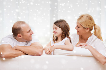 Image showing smiling parents and little girl at home