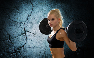 Image showing sporty woman exercising with barbell