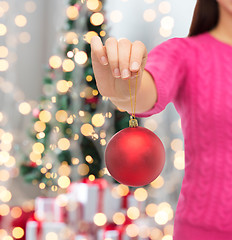 Image showing close up of woman in sweater with christmas ball