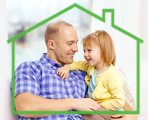 Image showing smiling father and daughter together at home