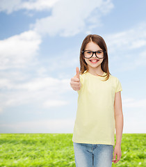 Image showing smiling cute little girl in black eyeglasses