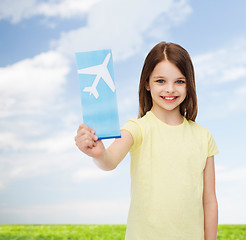 Image showing smiling little girl with airplane ticket