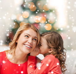 Image showing happy mother and girl whispering into ear