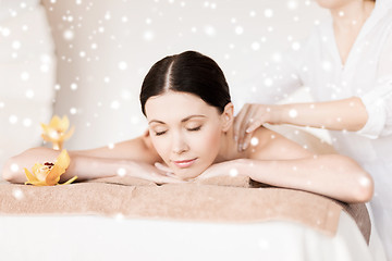 Image showing beautiful young woman in spa salon getting massage