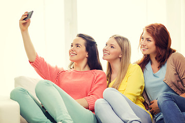 Image showing teenage girls taking selfie with smartphone