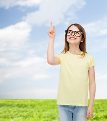 Image showing smiling cute little girl in black eyeglasses