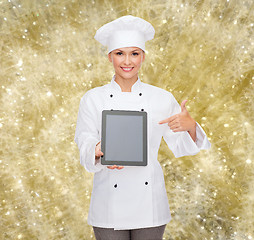 Image showing smiling female chef with tablet pc blank screen