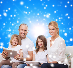 Image showing happy family with tablet pc computers