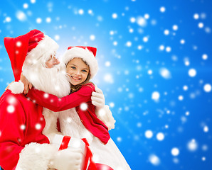 Image showing smiling little girl with santa claus