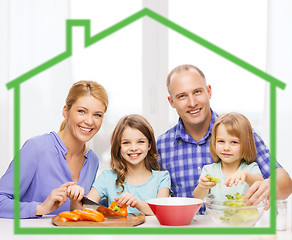 Image showing happy family with two kids making dinner at home