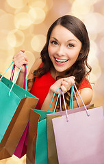 Image showing smiling woman with colorful shopping bags