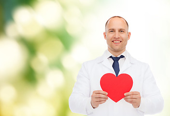 Image showing smiling male doctor with red heart