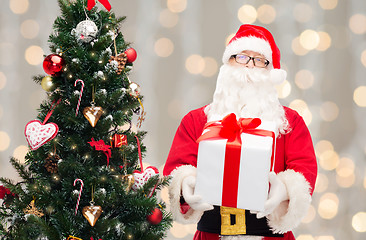 Image showing man in costume of santa claus with gift box