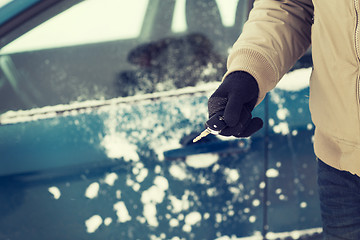 Image showing closeup of man hand with car key outdoors