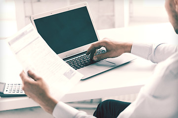 Image showing miling businessman working in office