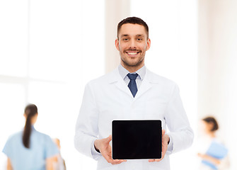 Image showing smiling male doctor with tablet pc