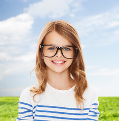 Image showing smiling cute little girl with black eyeglasses