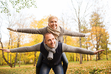 Image showing smiling couple having fun in autumn park