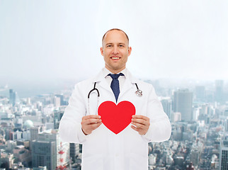 Image showing smiling male doctor with red heart and stethoscope