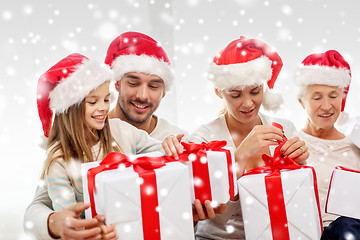 Image showing happy family sitting on couch at home