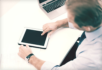 Image showing businessman with tablet pc in office