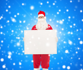 Image showing man in costume of santa claus with billboard