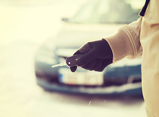 Image showing closeup of man hand with car key outdoors