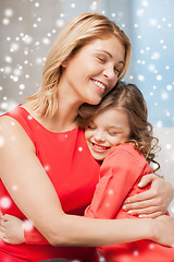 Image showing happy mother and daughter hugging at home