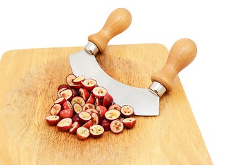 Image showing Chopped fresh cranberries with a rocking knife