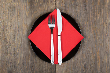 Image showing Plate, knfie and fork on a napkin.