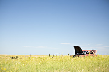 Image showing abandoned car in field