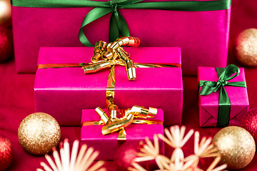 Image showing Four Plain Christmas Presents in Magenta