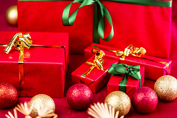 Image showing Five Xmas Gifts Wrapped in Plain Red