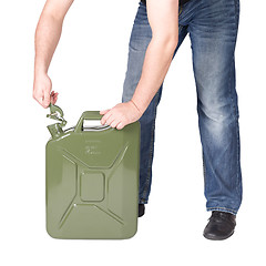 Image showing Man opening jerry can. 