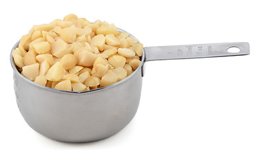 Image showing Chopped macadamia nuts in a cup measure