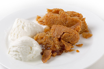 Image showing Traditional lemon Sussex pond pudding  and ice cream