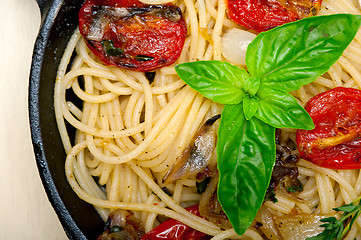 Image showing spaghetti pasta with baked cherry tomatoes and basil 